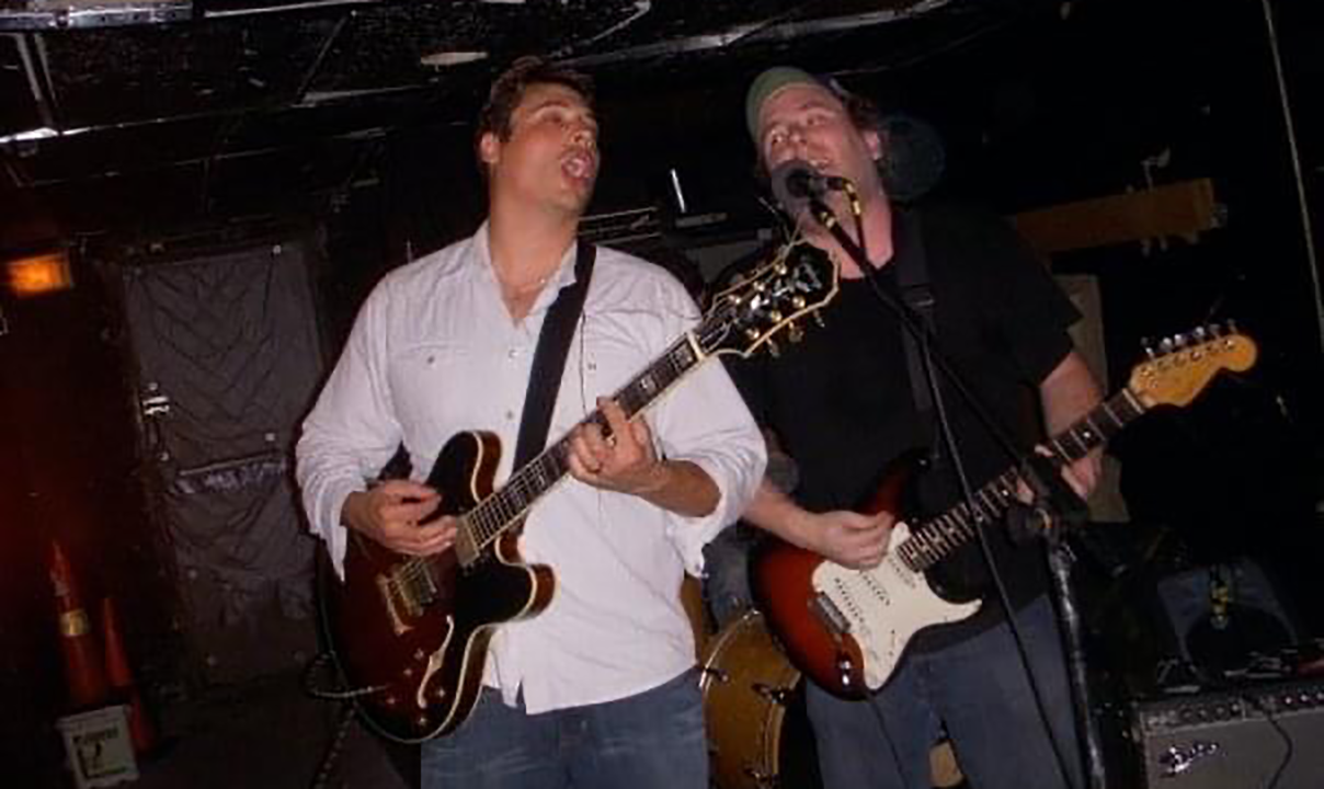 A photo of Tom singing with Jeff